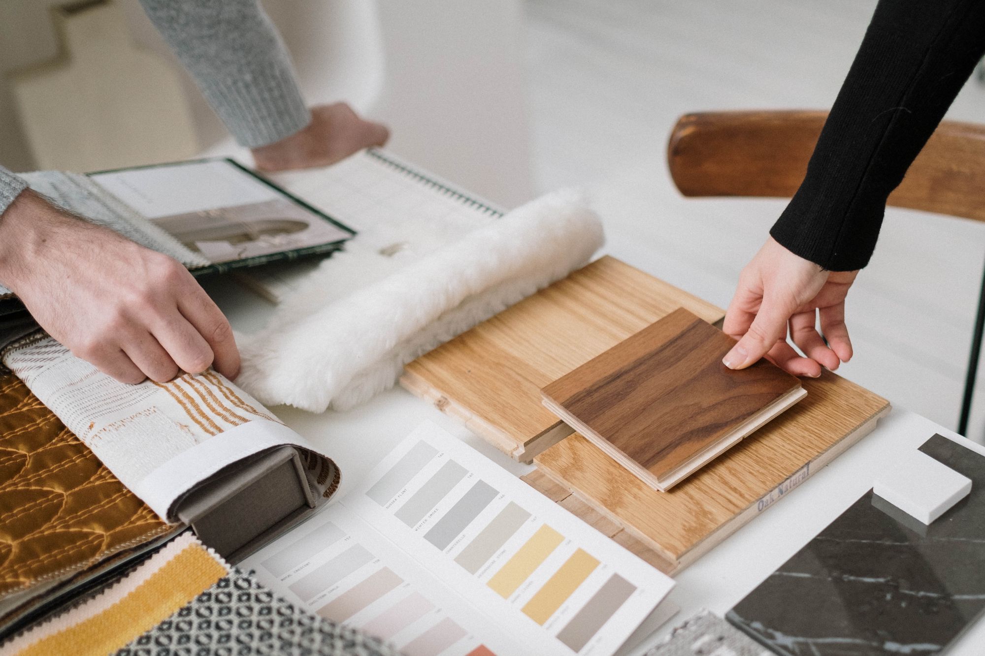 Wood, stone and textile samples laid out for a client presentation